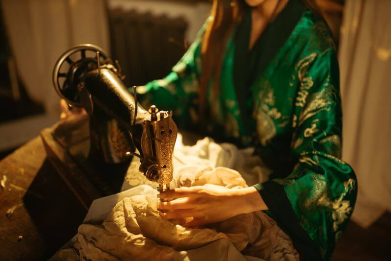 Woman in kimono sewing!